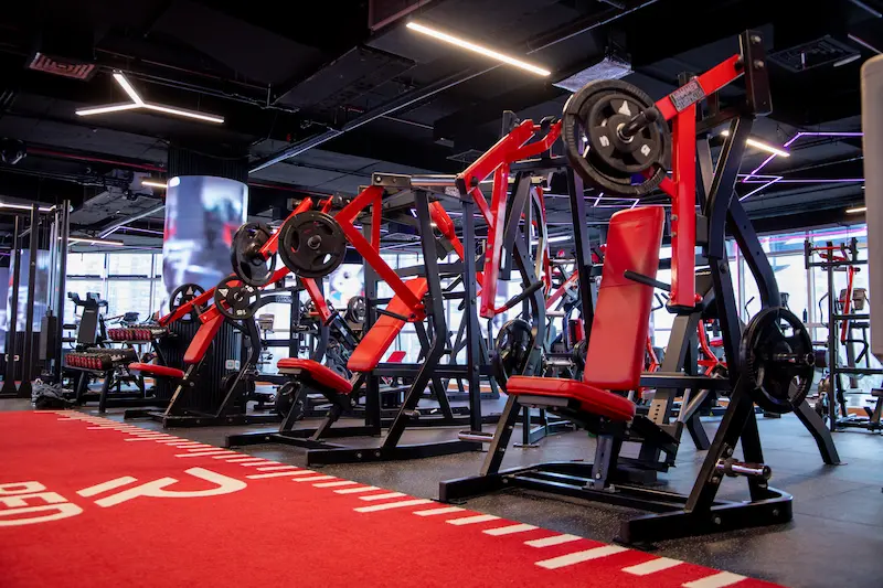 Strength training zone with Hammer Strength machines at Red Gym