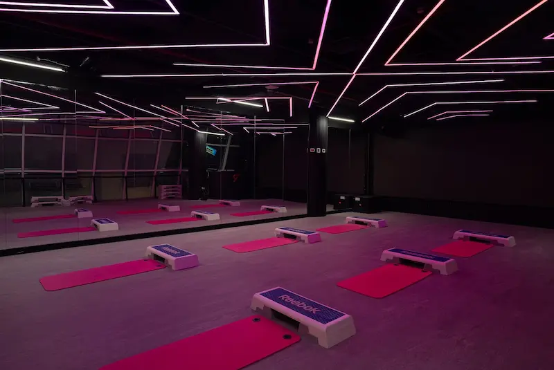 Studio classes with neon lighting at Red Gym Barsha Heights